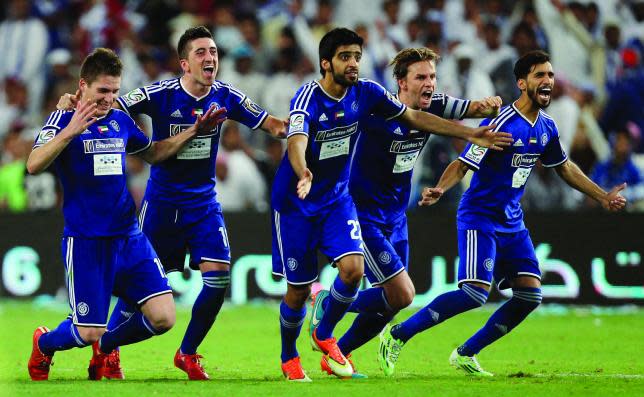 Al Nasr players surge ahead after sealing victory on Wednesday.