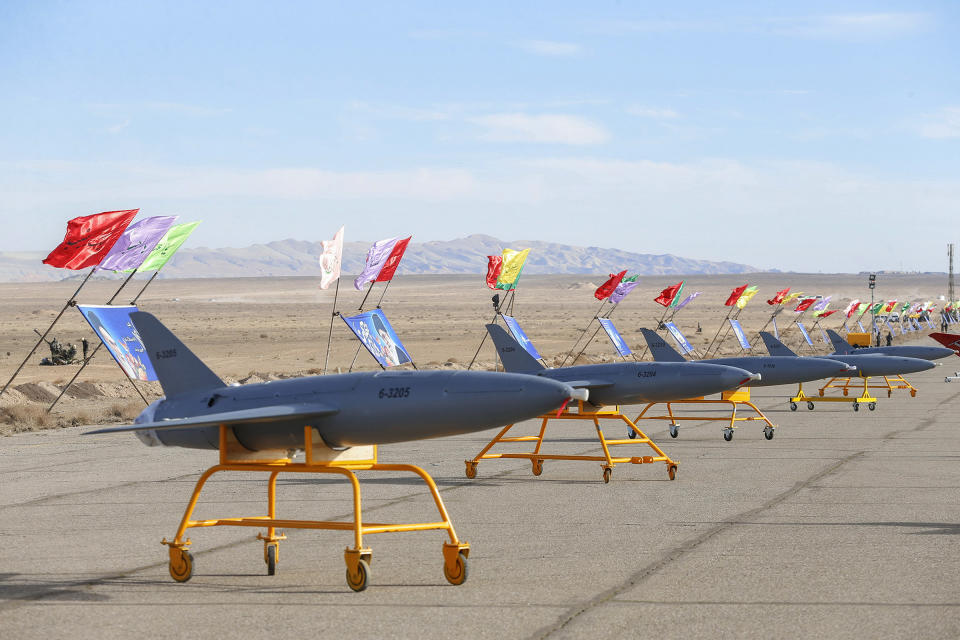 In this photo released on Tuesday, Jan. 5, 2021 by the Iranian army, drones are displayed prior to a drill, in an undisclosed location in Iran. The Iranian military began a wide-ranging, two-day aerial rill in the country's north, state media reported, featuring combat and surveillance unmanned aircraft, as well as naval drones dispatched from vessels in Iran's southern waters. (Iranian Army via AP)