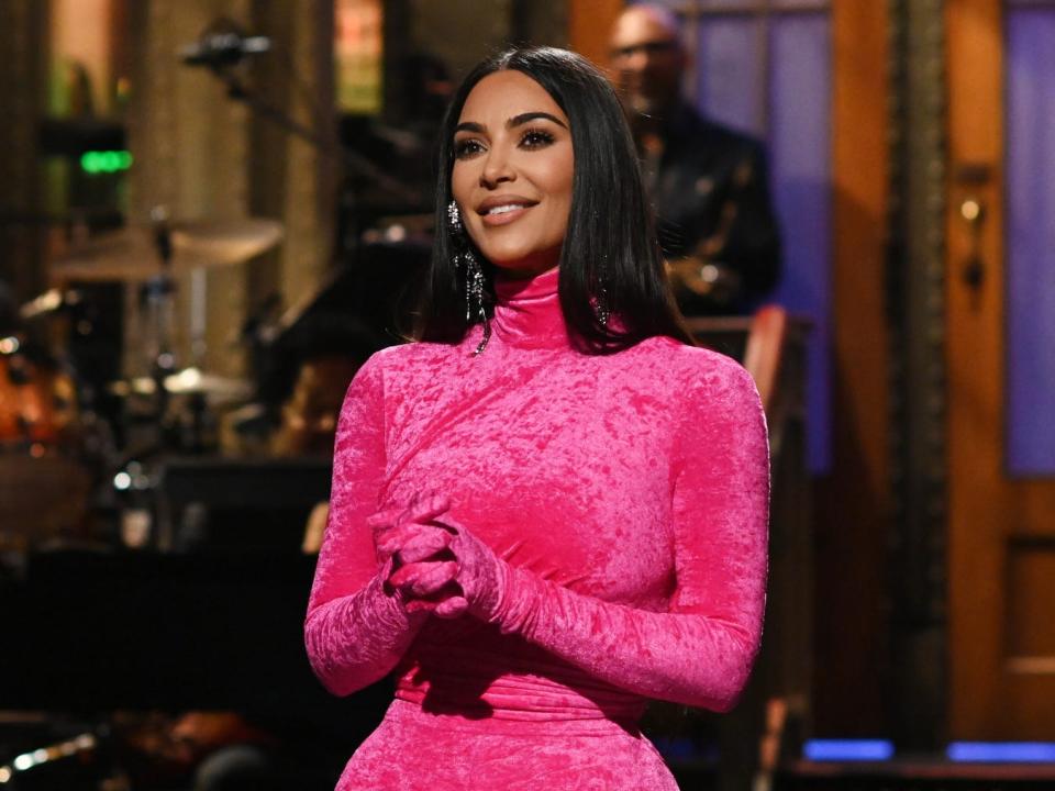 Kim Kardashian wearing a pink body suit during her appearance on "Saturday Night Live."