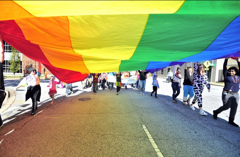 Participants march during the 2019 Upstate Pride parade.