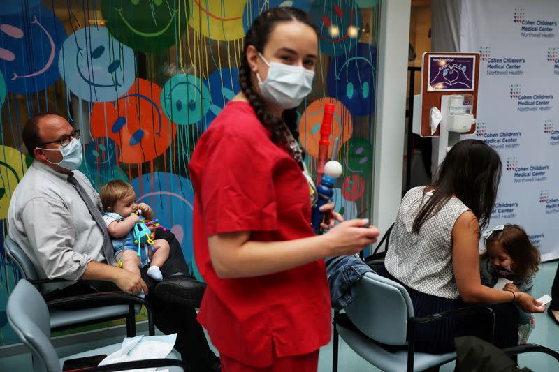 FILE PHOTO: Parents wait for their children to receive the vaccine against the coronavirus disease (COVID-19) at Northwell Health's Cohen Children's Medical Center in New Hyde Park, New York