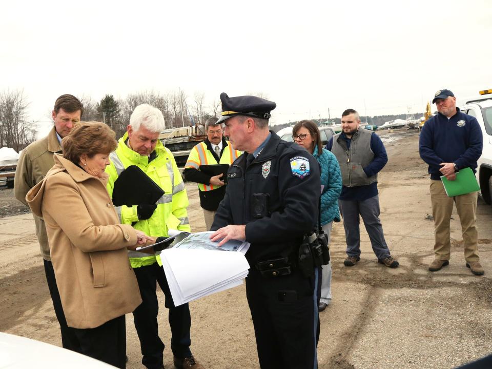 Sen. Jeanne Shaheen, D-New Hampshire, looks at images of storm related damage with Bill Cass, commissioner of New Hampshire Department of Transportation, and Rye Police Chief Kevin Walsh Friday, Feb. 2, 2024.
