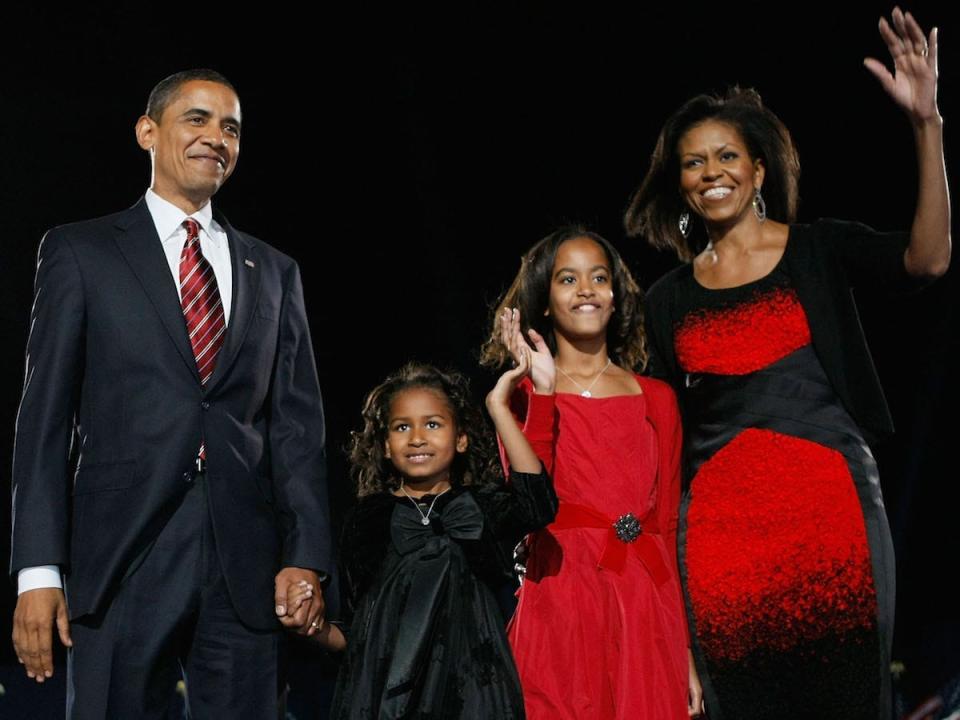 The Obama family in 2008 on election night wearing coordinating red outfits.