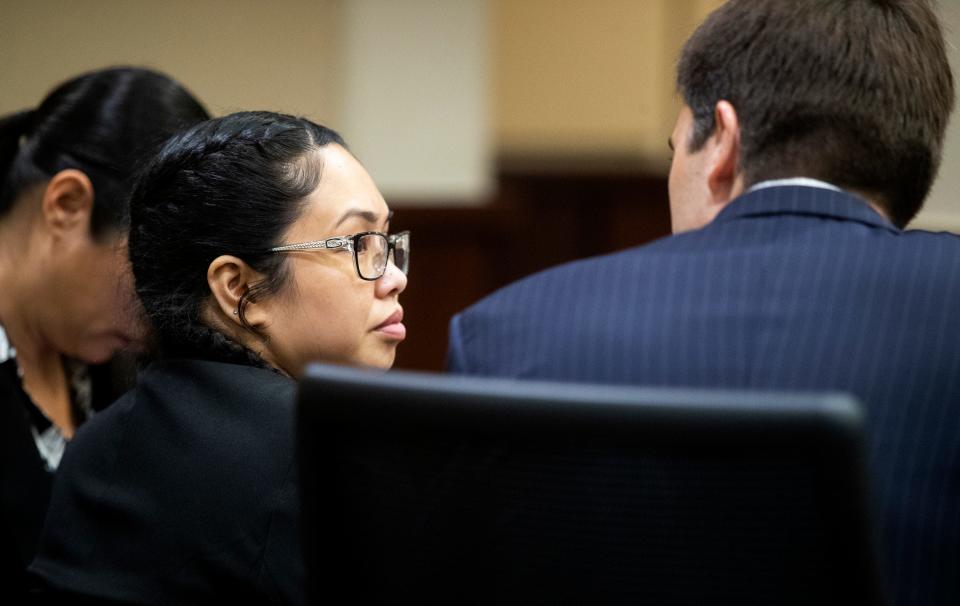 Katherine Magbanua listens to defense attorney Christopher DeCoste at the start of jury selection on Monday, May 16, 2022 for Magbanua's trial on charges she was involved in the murder of Dan Markel.