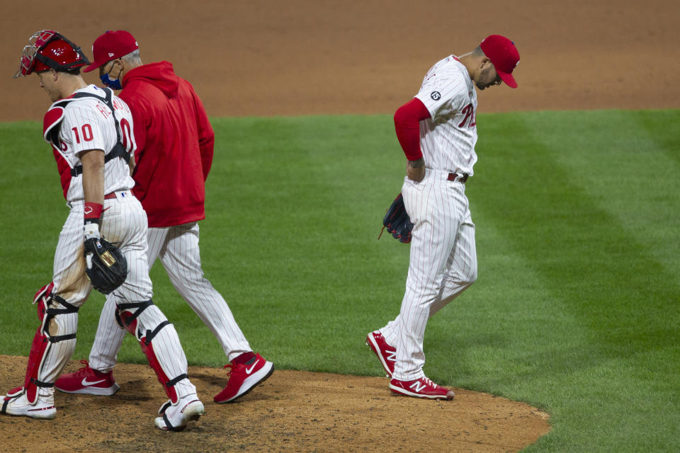 Philadelphia Phillies pitcher Vince Velasquez (21) walks off the mound after walking New York Mets Brandon Nimmo allowing Luis Guillorme to score during the seventh inning of a baseball game, Tuesday, April 6, 2021, in Philadelphia. (AP Photo/Laurence Kesterson)