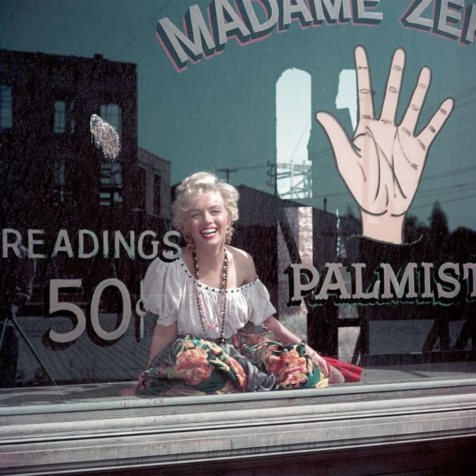 <p>Dressed as a gypsy palm reader after ransacking the 20th Century Fox costume department with photographer Milton Greene in April 1956.<br></p><p><br></p>