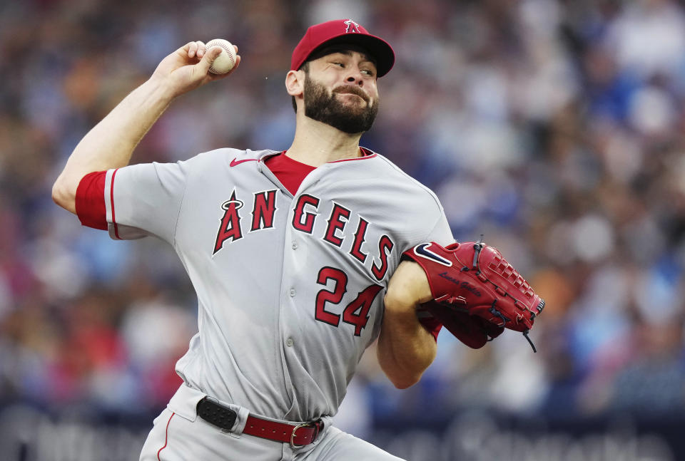 Los Angeles Angels starting pitcher Lucas Giolito works against the Toronto Blue Jays during the first inning of a baseball game Friday, July 28, 2023, in Toronto. (Nathan Denette/The Canadian Press via AP)