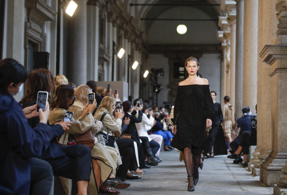 A model wears a creation as part of the Max Mara 2021 women's spring-summer ready-to-wear collection during the Milan's fashion week in Milan, Italy, Thursday, Sept. 24, 2020. (AP Photo/Antonio Calanni)