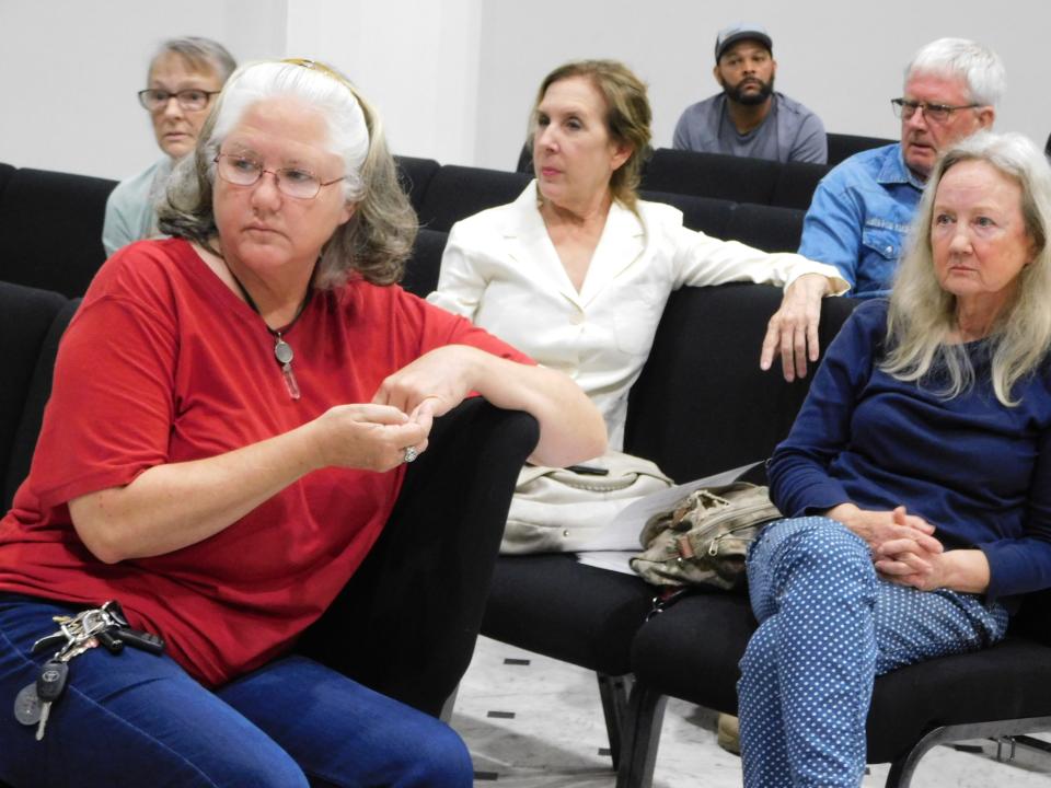 Members of the public attend a public hearing last week at the Delta Grand in Opelousas. The hearing is one of several in the next two weeks on a proposed animal control ordinance seeking to better regulate dog breeding in the parish, among other things.