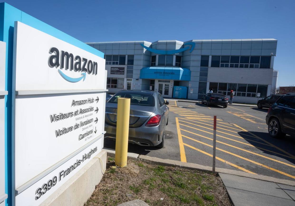 Hundreds of Amazon workers at a warehouse in Laval, Que., will be represented by Quebec's CSN union. (Ryan Remiorz/The Canadian Press - image credit)