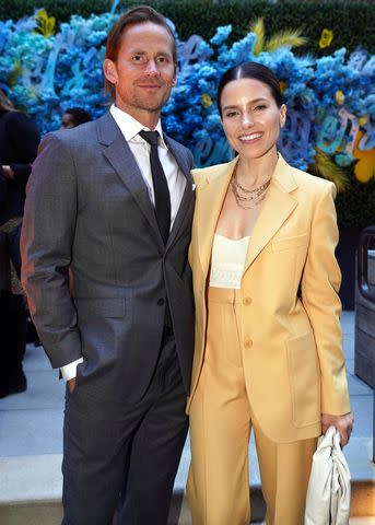 <p>Leigh Vogel/Getty</p> Grant Hughes and Sophia Bush in April 2022.