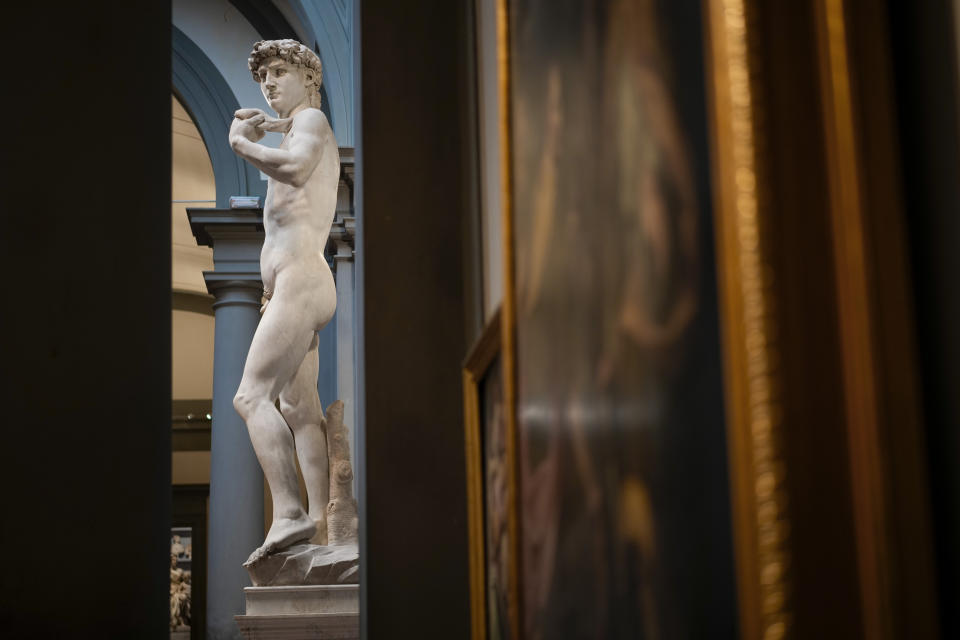 Michelangelo's 16th century statue of David is seen on display at the Accademia gallery, in Florence, central Italy, Monday, March 18, 2024. Michelangelo’s David has been a towering figure in Italian culture since its completion in 1504. But curators worry the marble statue’s religious and political significance is being diminished by the thousands of refrigerator magnets and other souvenirs focusing on David’s genitalia. The Galleria dell’Accademia’s director has positioned herself as David’s defender and takes swift aim at those profiteering from his image. (AP Photo/Andrew Medichini)