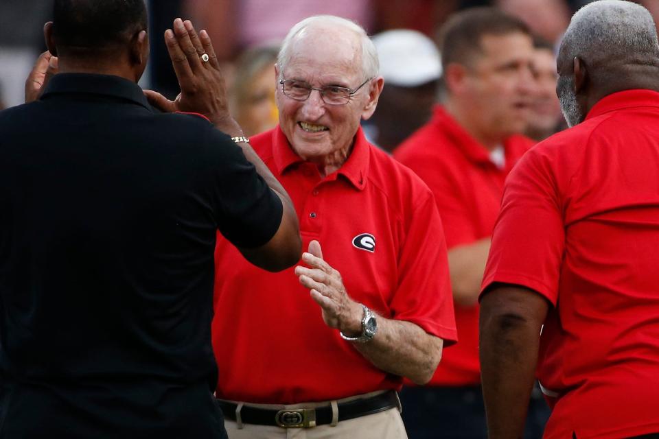 Former Georgia coach Vince Dooley on the field while UGA honored the first five Black Bulldog football players before the start of an NCAA college football game between South Carolina and Georgia in Athens, Ga., on Sept. 18, 2021.

News Joshua L Jones