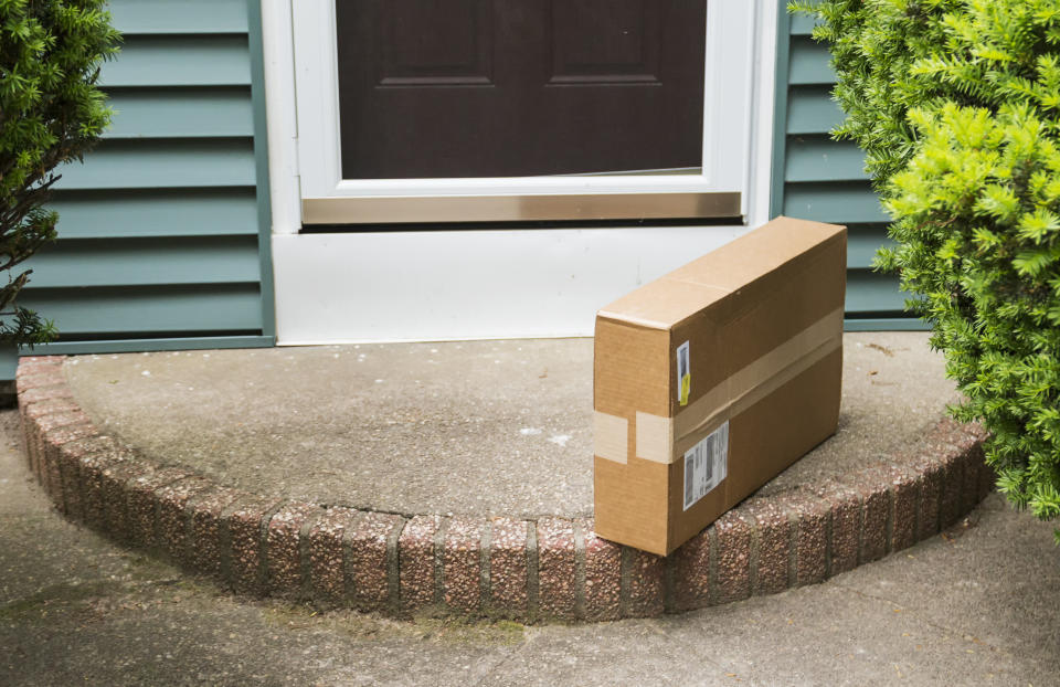 A box sitting on a doorstep.