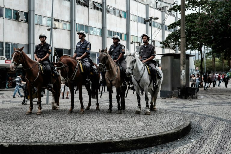 Mounted police officers patrol Rio de Janeiro's downtown on May 5, 2015