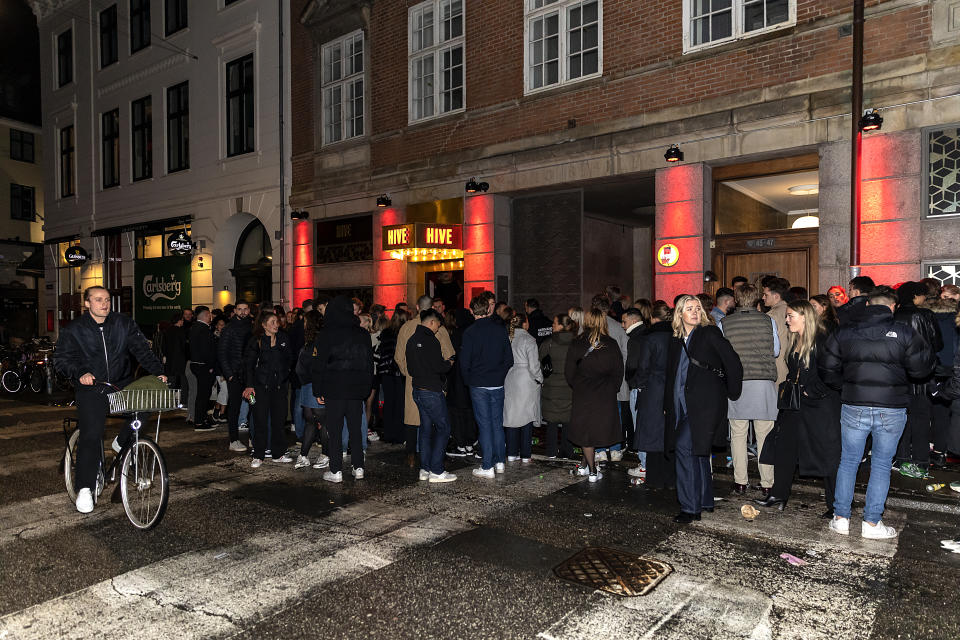 COPENHAGEN, DENMARK - FEBRUARY 04: People wait in line to enter the nightclub, HIVE, on February 4, 2022 in Copenhagen, Denmark. Denmark lifted COVID-19 restrictions nationwide, making them the first country in the European Union to do so.  (Photo by Ole Jensen/Getty Images)