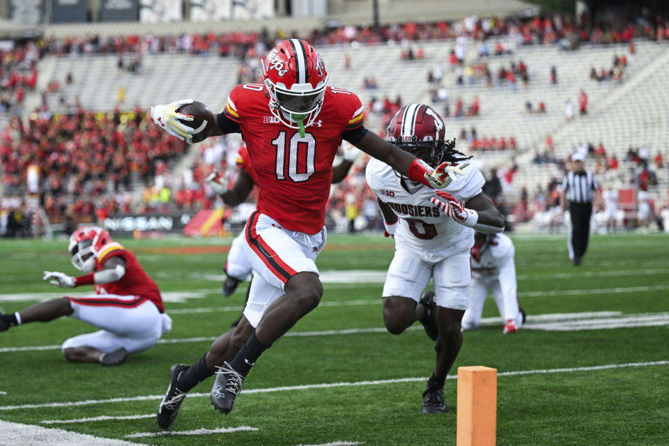 Maryland wide receiver Tai Felton (10) runs with the ball after making a catch and scores a touchdown as Indiana defensive back Noah Pierre pursues during the first half of an NCAA college football game, Saturday, Sept. 30, 2023, in College Park, Md. (AP Photo/Terrance Williams)