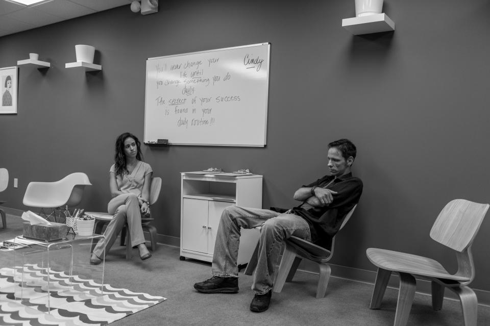 <p>Jack Barrett, a recovering heroin addict, sits in the group therapy room under the watchful eye of counselor Ana Cristina Weickert at Groups in Middletown, Ohio.<br> (Photograph by Mary F. Calvert for Yahoo News) </p>