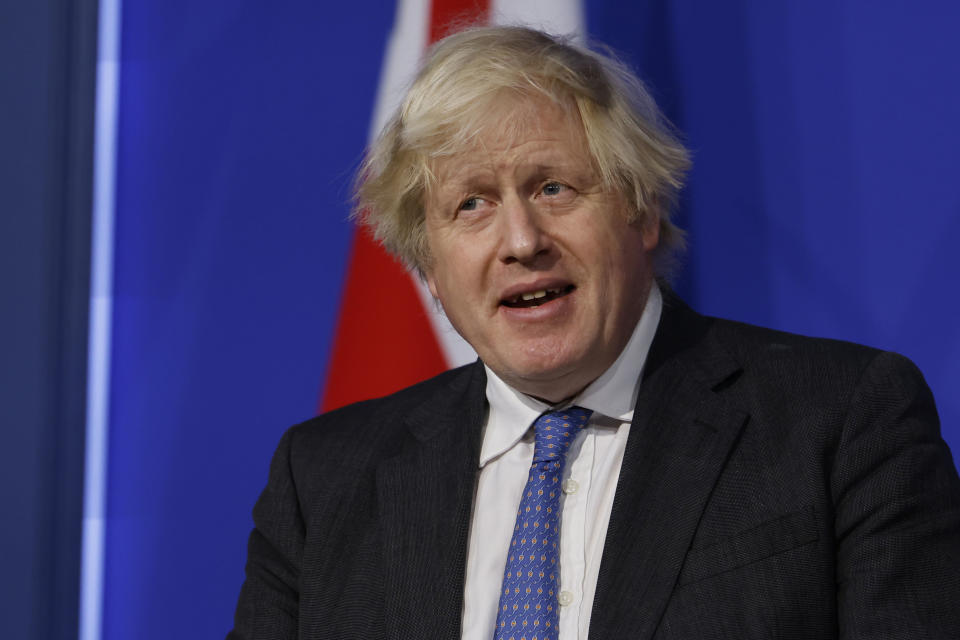 Britain's Prime Minister Boris Johnson speaks during a media briefing on COVID-19, in Downing Street, London, Wednesday Dec. 15, 2021. (Tolga Akmen/Pool via AP)