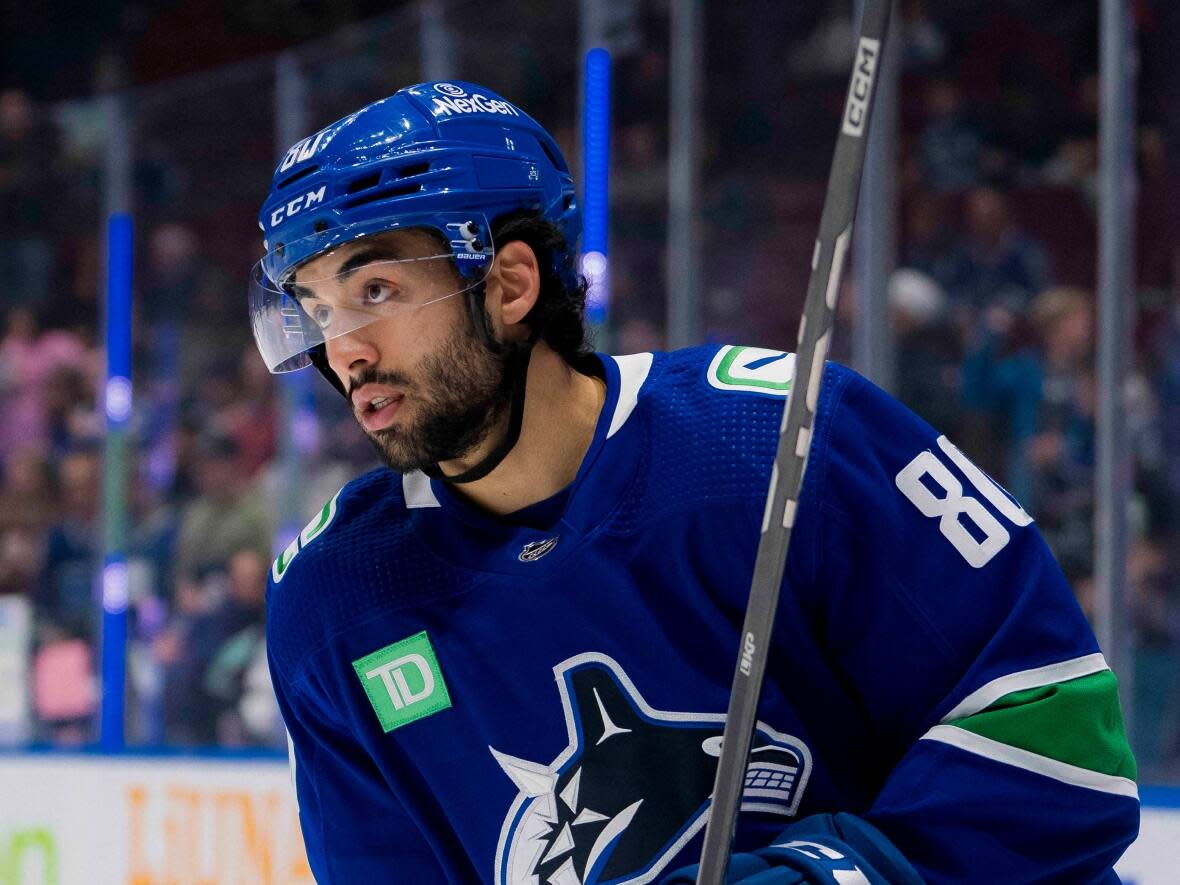 Vancouver Canucks forward Arshdeep Bains skates during warm-up before the game against the Winnipeg Jets on Saturday. The 23-year-old was called up to the team's roster for the game against the Jets on Saturday. (Bob Frid/USA TODAY Sports via Reuters Connect - image credit)