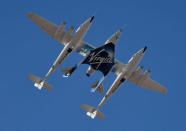 Virgin Galactic rocket plane, the WhiteKnightTwo carrier airplane, with SpaceShipTwo passenger craft takes off from Mojave Air and Space Port in Mojave, California, U.S., February 22, 2019. REUTERS/Gene Blevins