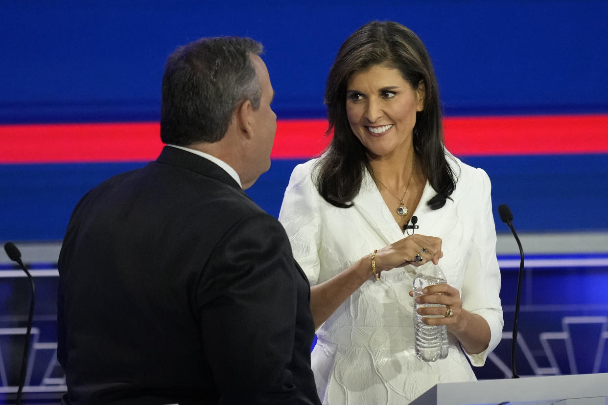 Republican presidential candidates former U.N. Ambassador Nikki Haley talks with former New Jersey Gov. Chris Christie during a break at the Republican presidential primary debate hosted by NBC News, Wednesday, Nov. 8, 2023, at the Adrienne Arsht Center for the Performing Arts of Miami-Dade County in Miami. (AP Photo/Rebecca Blackwell)