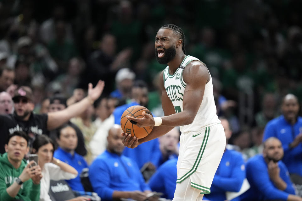 Boston Celtics guard Jaylen Brown argues after he was called for an offensive foul against the Dallas Mavericks during the second half of Game 1 of basketball's NBA Finals on Thursday, June 6, 2024, in Boston. (AP Photo/Charles Krupa)