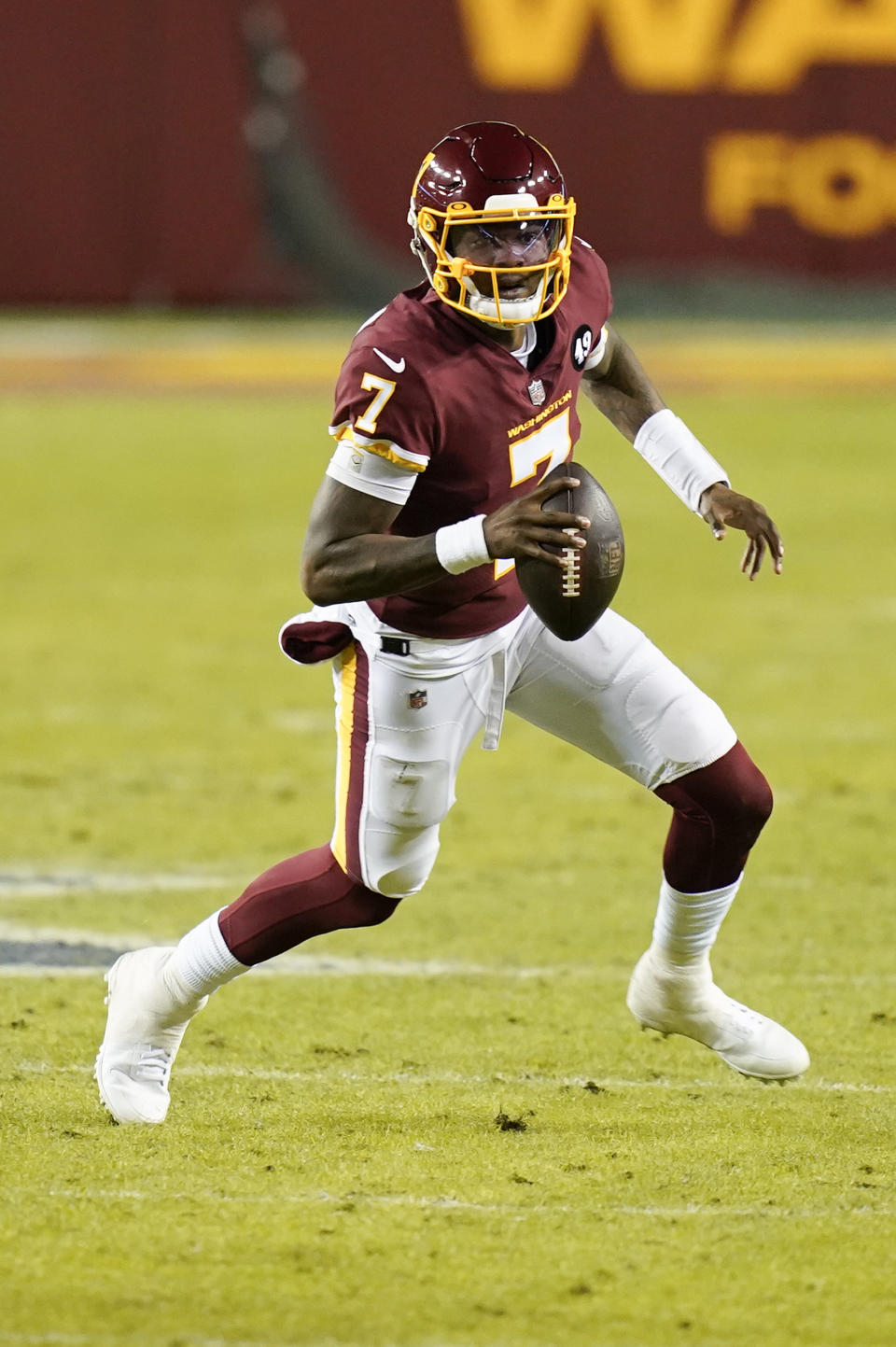 Washington Football Team quarterback Dwayne Haskins (7) runs with the ball during the first half of an NFL football game against the Carolina Panthers, Sunday, Dec. 27, 2020, in Landover, Md. (AP Photo/Carolyn Kaster)