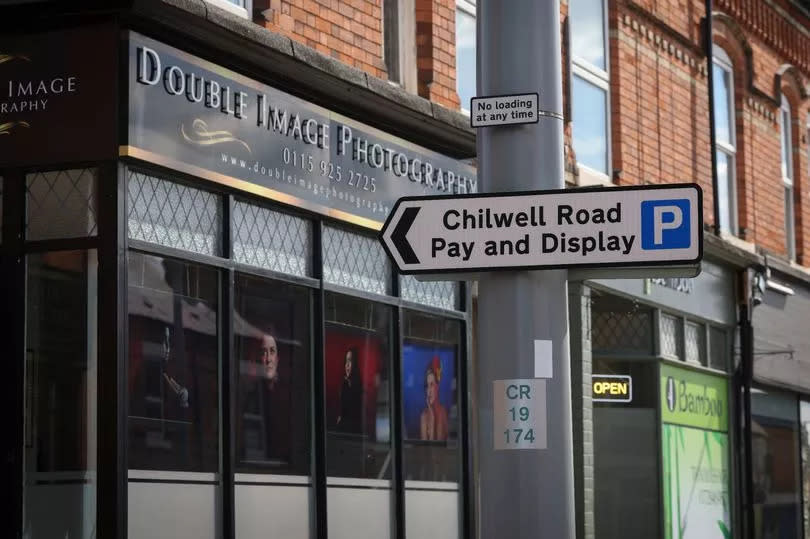 A parking sign outside Double Image Photography in Chilwell Road, Beeston, which reads 'Chilwell Road Pay and Display'