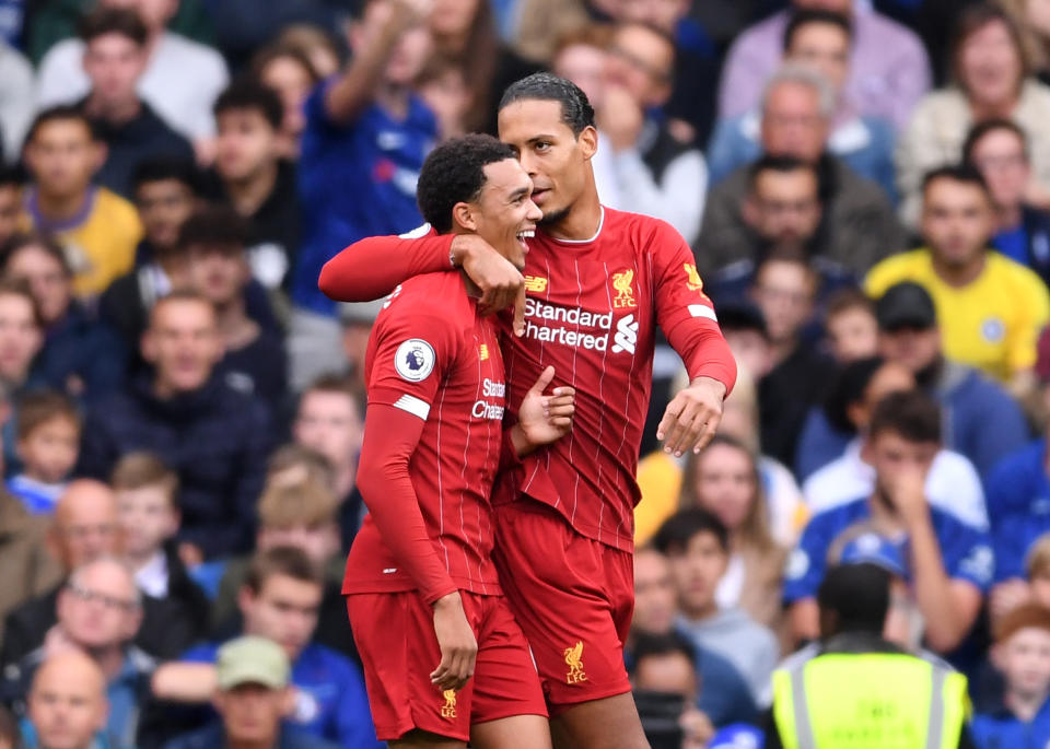 LONDON, ENGLAND - SEPTEMBER 22: Trent Alexander-Arnold (L) of Liverpool celebrates scoring the opening goal with Virgil van Dijk of Liverpool during the Premier League match between Chelsea FC and Liverpool FC at Stamford Bridge on September 22, 2019 in London, United Kingdom. (Photo by Laurence Griffiths/Getty Images)