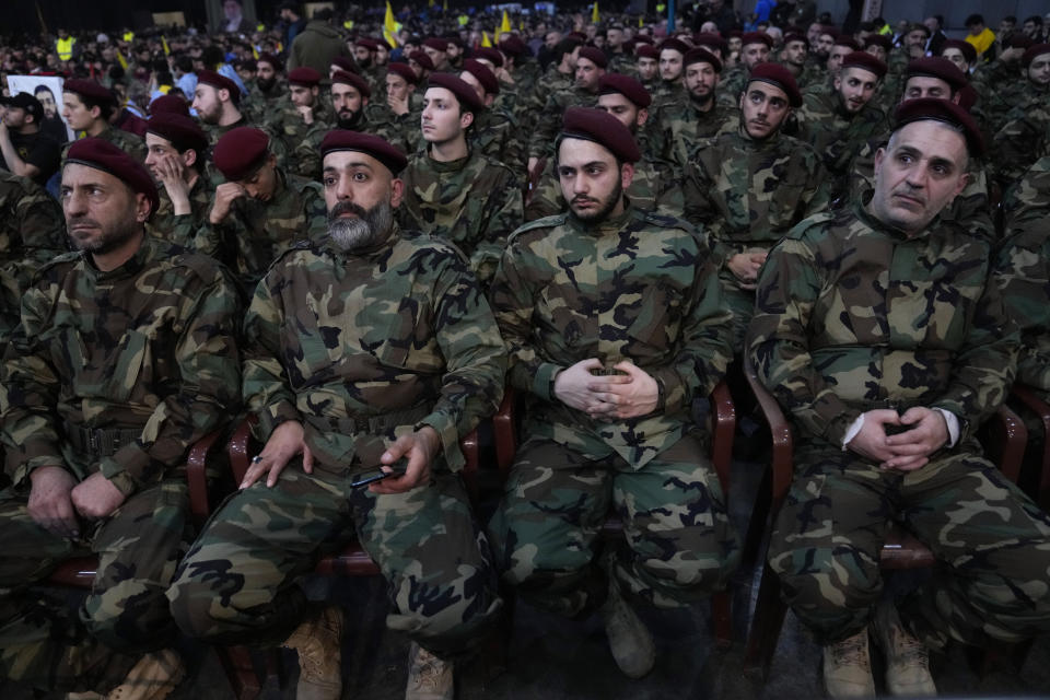 Hezbollah fighters listen to the speech of their leader Sayyed Hassan Nasrallah, during a rally to mark Jerusalem day, in a southern suburb of Beirut, Lebanon, Friday, April 14, 2023. Since Iran's Islamic Revolution in 1979, the rallies marking what is also known as al-Quds Day have typically been held on the last Friday of the Muslim holy month of Ramadan. (AP Photo/Hussein Malla)
