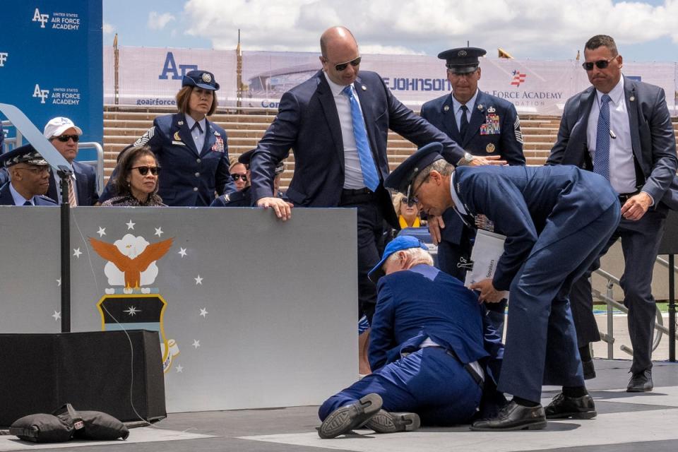 President Joe Biden falls on stage during the 2023 United States Air Force Academy Graduation Ceremony at Falcon Stadium, United States Air Force Academy in Colorado Springs (AP)