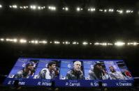 Seattle Seahawks head coach Pete Carroll (C) is shown on a video monitor with (L to R) Earl Thomas, quarterback Russell Wilson, cornerback Richard Sherman and strong safety Kam Chancellor during Media Day for Super Bowl XLVIII at the Prudential Center in Newark, New Jersey January 28, 2014. REUTERS/Shannon Stapleton