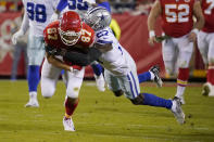 Kansas City Chiefs tight end Travis Kelce (87) catches a pass as Dallas Cowboys safety Jayron Kearse (27) defends during the second half of an NFL football game Sunday, Nov. 21, 2021, in Kansas City, Mo. (AP Photo/Ed Zurga)