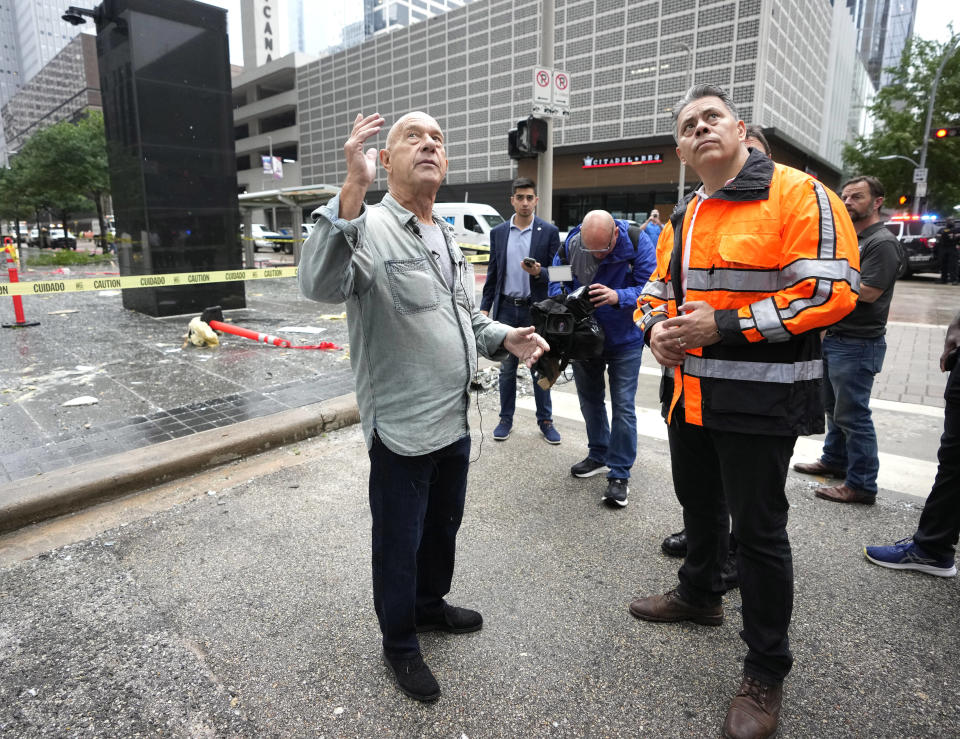 Mayor John Whitmire and Fire Chief Samuel Pena survey damaged buildings downtown on Friday, May 17, 2024, in Houston, after a strong thunderstorm moved through Thursday evening. (Karen Warren/Houston Chronicle via AP)