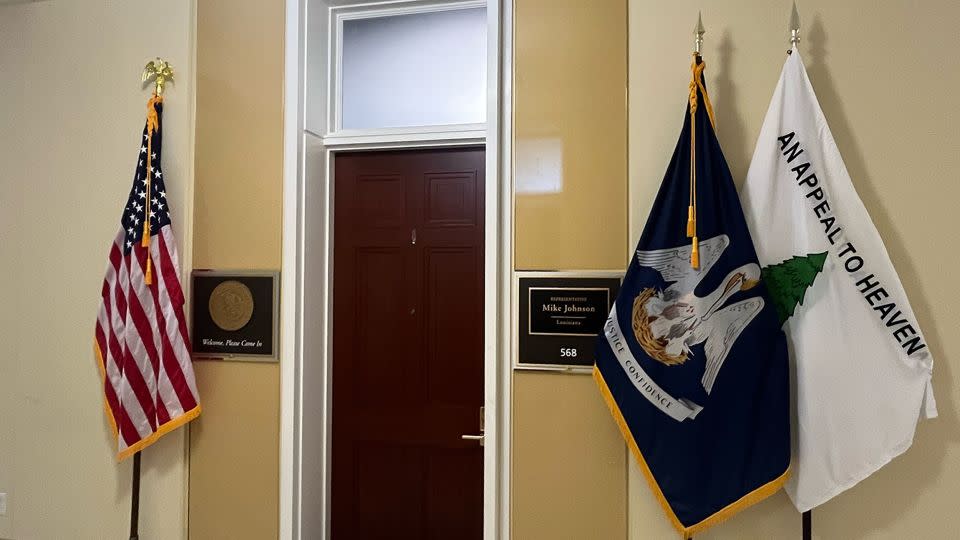 An "Appeal to Heaven" flag is seen outside Speaker Mike Johnson's personal office in the Cannon House Office Building on Wednesday, May 22. - CNN