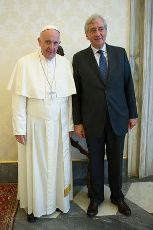 Pope Francis meets Libero Milone (R), the Vatican's auditor general, at the Vatican, April 1, 2016. Picture taken April 1 2016. Osservatore Romano/Handout via REUTERS