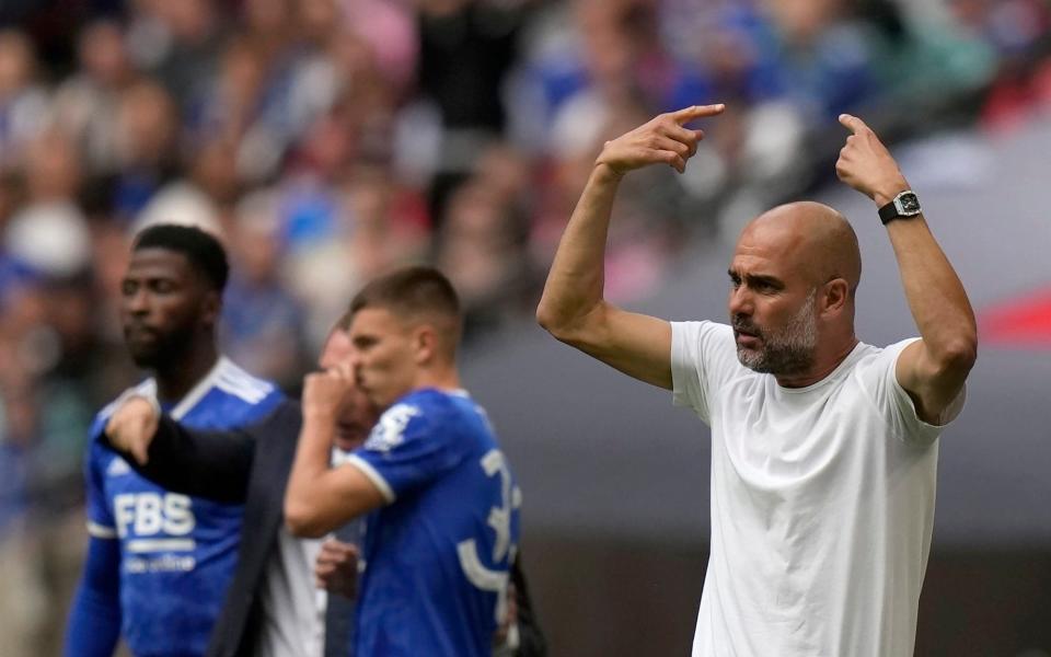 Pep Guardiola was in tetchy mood throughout, and was booked - AP