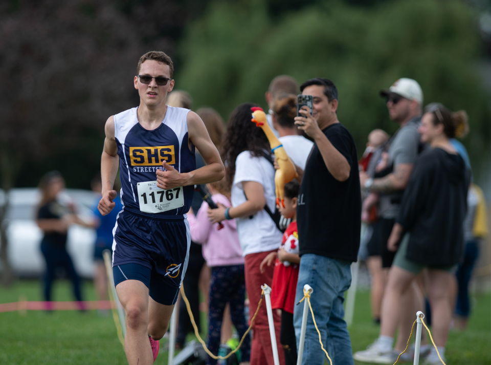 Streetsboro's Timothy Harkleroad with a fourth-place finish of 17:41.12 at the Streetsboro Rockets XC Invitational on Saturday.