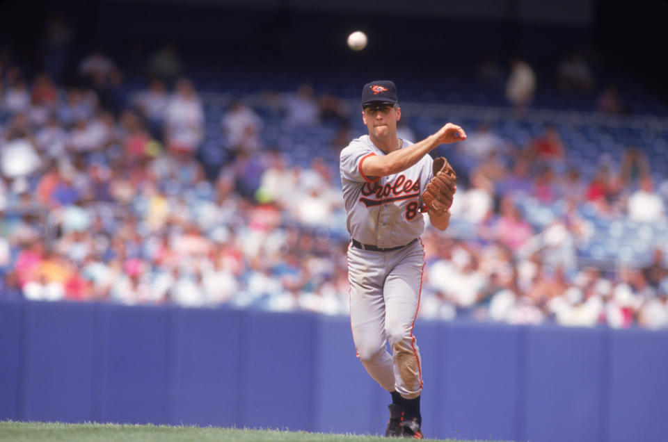 BRONX, NY - 1992: Baltimore Orioles' shortstop Cal Ripken Jr. #8 throws to first duing a game against the New York Yankees at Yankee Stadium circa 1992 in Bronx, New York. (Photo by Focus on Sport via Getty Images)