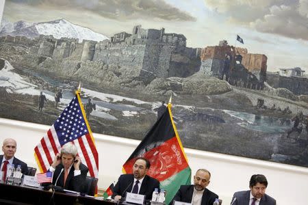 U.S. Secretary of State John Kerry (2nd L) listens as Afghanistan's Foreign Minister Salahuddin Rabbani (C) speaks at the start of their bilateral commission talks at Char Chinar Palace in Kabul April 9, 2016. REUTERS/Jonathan Ernst - RTX296NZ
