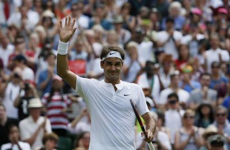 Roger Federer of Switzerland celebrates after winning his match against Sam Querrey of the U.S.A. at the Wimbledon Tennis Championships in London, July 2, 2015. REUTERS/Stefan Wermuth