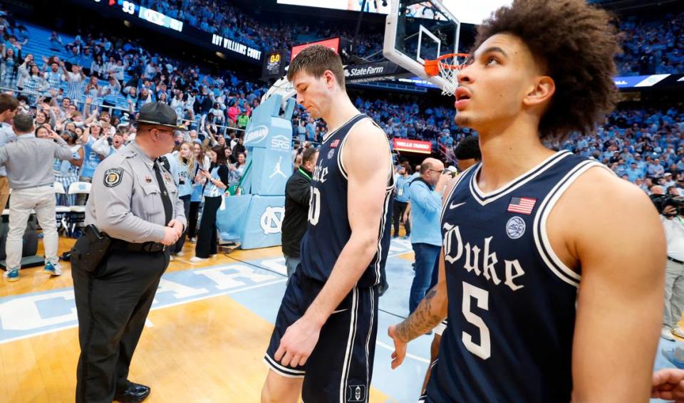 Duke’s Kyle Filipowski (30) and Tyrese Proctor (5) walk off the court after UNC’s 93-84 victory over Duke at the Smith Center in Chapel Hill, N.C., Saturday, Feb. 3, 2024.