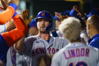 New York Mets' Pete Alonso celebrates his home run with teammates during the third inning of a baseball game against the Philadelphia Phillies, Friday, Aug. 19, 2022, in Philadelphia. (AP Photo/Chris Szagola)