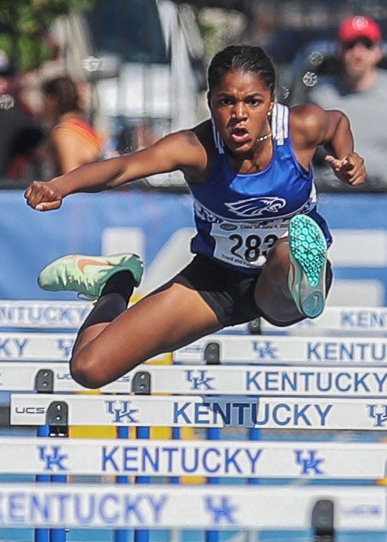 EasternÕs Aliyah Allen jumps over a hurdle during the 100-meter hurdles in the at the KHSAA Class 3A State Track Meet in Lexington, Kentucky on June 4, 2022.