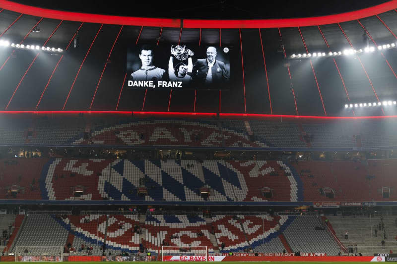 The scoreboard in the stadium shows photos of the late Franz Beckenbauer with the words "Thank you, Franz" ahead of the German Bundesliga soccer match between Bayern Munich and TSG 1899 Hoffenheim at the Allianz Arena. Daniel Löb/dpa