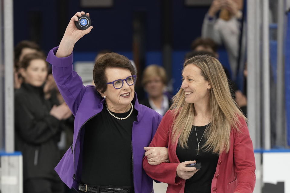 PWHL board member Billie Jean King, left, and PWHL executive Jayna Hefford get set for the ceremonial faceoff before the inaugural PWHL hockey game between New York and Toronto in Toronto on Monday, Jan.1, 2024. (Frank Gunn