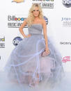 Underwood had a princess moment at last year's Billboard Music Awards. Her gray-and-rose tulle Oscar de la Renta gown made her the belle of the ball with its layers upon layers of tulle. The clutch also gave a fun flare to the look. Underwood’s hair was equally gorgeous – her wavy locks were worn down. (5/20/2012)