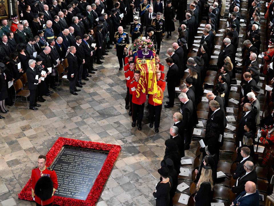 The coffin of Britain's Queen Elizabeth II is carried out of the Westminster Abbey in London on September 19, 2022, during the State Funeral Service.