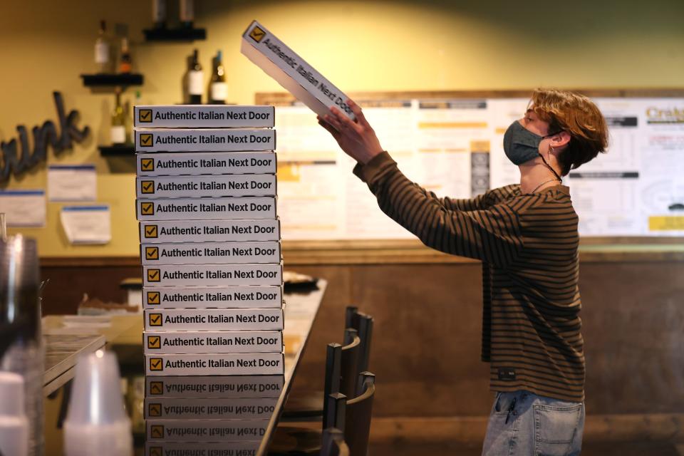 Eli Robinson preps boxes at CraigO&#39;s Pizza and Pastaria in Lakeway on Thursday, Feb. 25, 2021. Owner Andrew Rincon opened up the pizza shop after the storm to cook with a full staff and volunteers to feed more than 750 people over three days. &quot;Our staff was amazing and we&#39;re getting a lot of credit, but it was the community that was phenomenal,&quot; said Rincon.